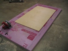 A 4'x8' sheet of 2" thick pink insulation makes an excellent sacrificial cutting surface.